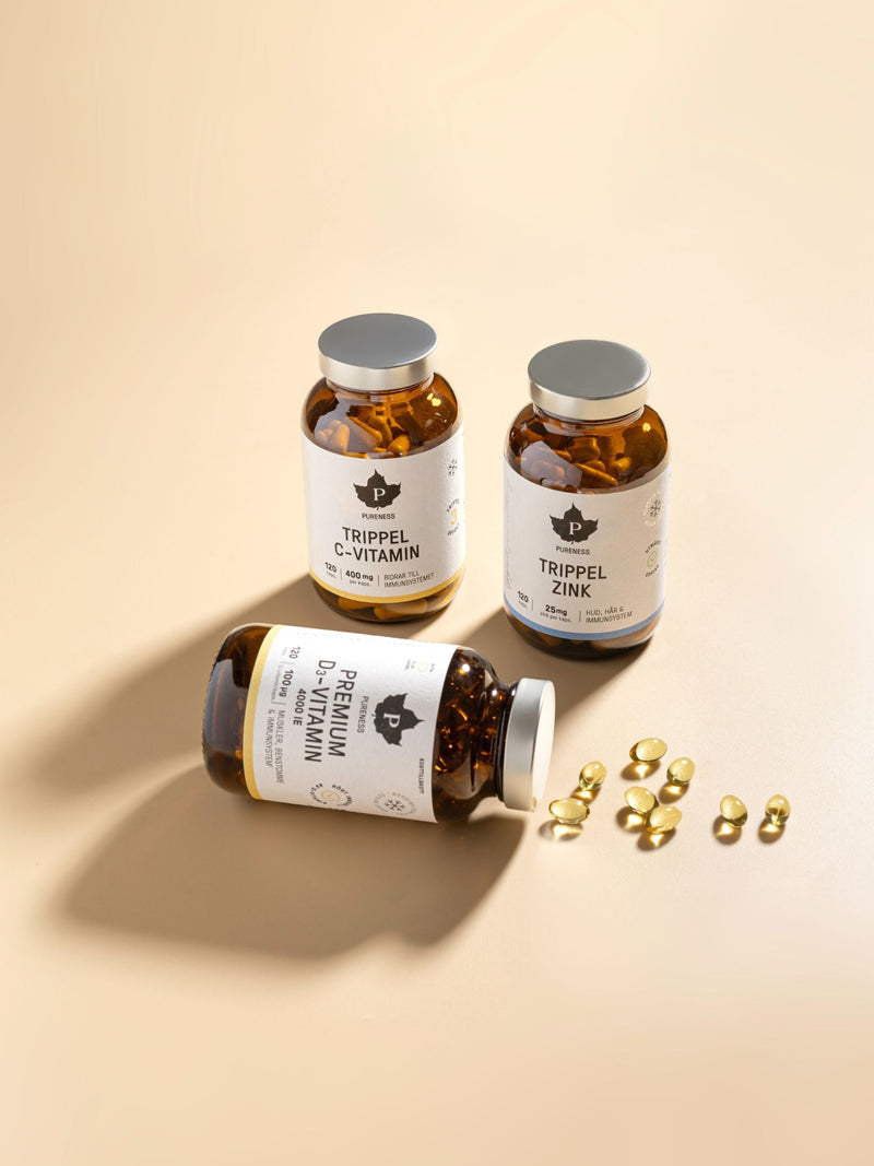 Pureness trippel c-vitamin, trippel zink, premium d-vitamin med en beige bakgrund