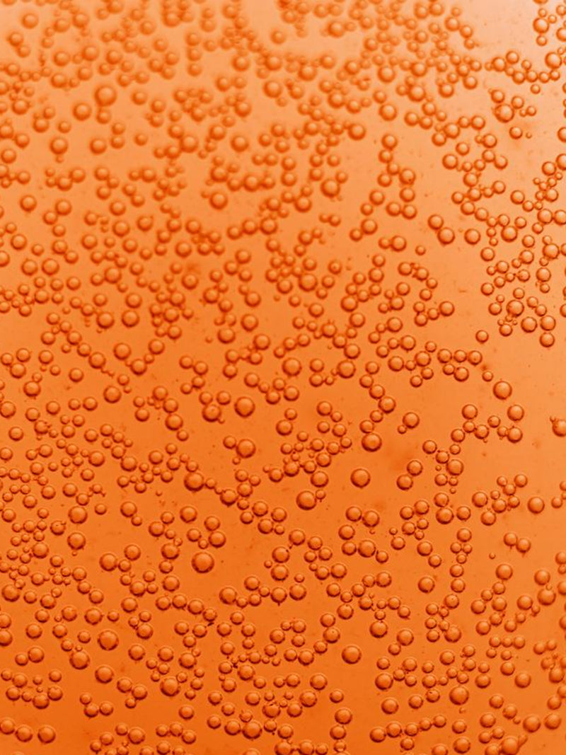 Pureness kombucha goji passion kolsyrebubblor fyller skärmen i en orange ton